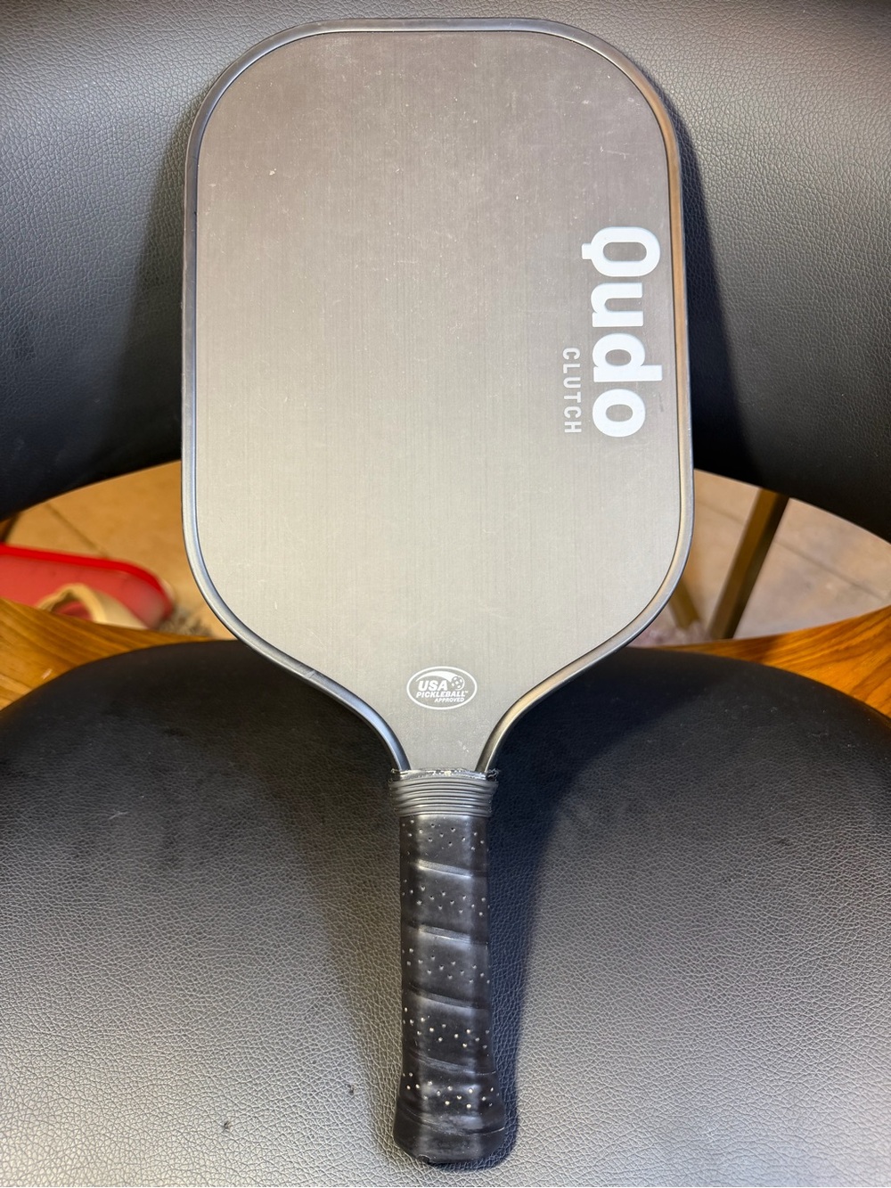 Qudo Clutch pickleball paddle with a carbon fiber surface.